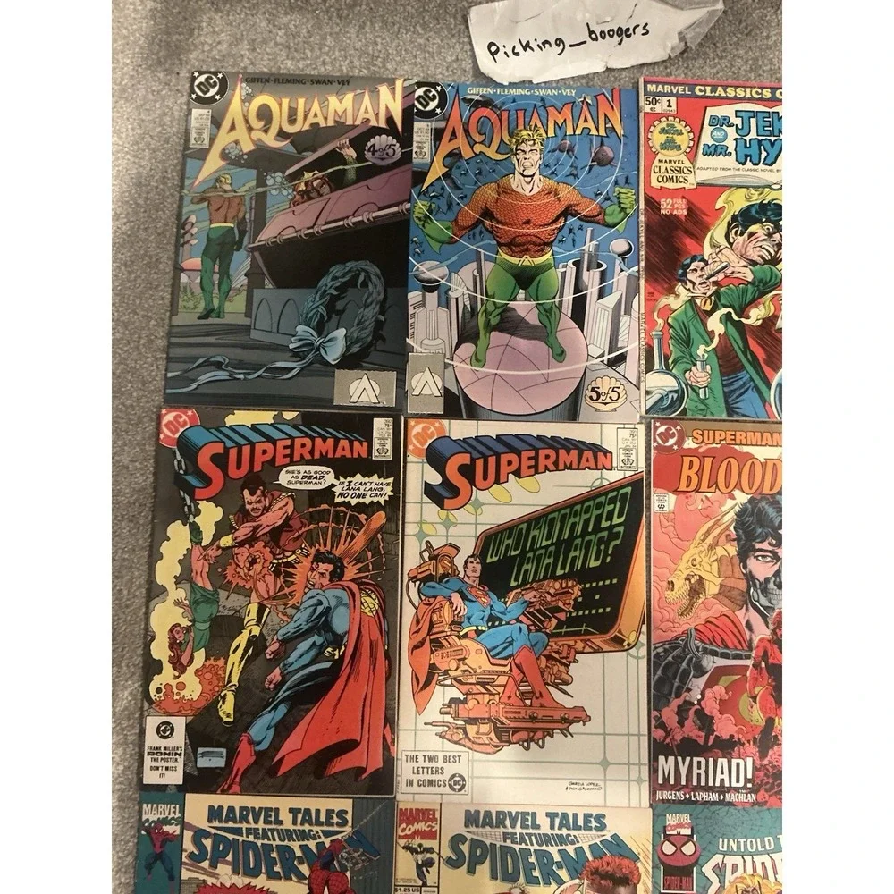 Vintage 15 lot of superhero comic books from both DC and Marvel publishers.